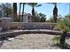 Stone sign marking the entrance to Pacific Legends with lush landscaping at 1830 N Buffalo Dr # 1010, Las Vegas, NV 89128