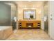 Bathroom featuring a glass shower, double vanity, and marble tile flooring at 2000 Fashion Show Dr # 5022, Las Vegas, NV 89109