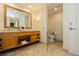 Elegant bathroom featuring glass shower, vanity with marble countertop, and toilet at 2000 Fashion Show Dr # 5022, Las Vegas, NV 89109