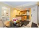 Functional kitchenette with a modern kitchen and a sleek black round table and chairs at 2000 Fashion Show Dr # 5022, Las Vegas, NV 89109