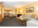 Inviting suite living space with a comfortable sofa, chairs, and an open kitchen area at 2000 Fashion Show Dr # 5022, Las Vegas, NV 89109