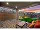 Covered patio, seating, backyard, and retaining wall at 2004 Peaceful Mesa Ct, Henderson, NV 89052