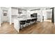 Bright, open kitchen with a large island, stainless steel appliances and modern white cabinetry at 2004 Peaceful Mesa Ct, Henderson, NV 89052