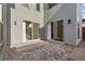 Spacious outdoor patio with sliding glass doors that seamlessly connects indoor and outdoor living spaces at 2004 Peaceful Mesa Ct, Henderson, NV 89052