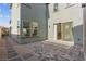 Exterior patio with gray brick, slider, and gravel at 2004 Peaceful Mesa Ct, Henderson, NV 89052