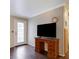 Light and bright living room featuring hardwood flooring, a decorative door, and a desk at 2132 Chertsey Dr # B, Las Vegas, NV 89108