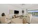 Bright living room with a comfortable seating arrangement and large windows offering scenic views of the outdoors at 214 Piazzetta Pl, Henderson, NV 89011