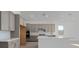 Modern kitchen features gray cabinets, stainless appliances, and an island at 218 Piazzetta Pl, Henderson, NV 89011