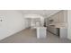 Spacious kitchen featuring a center island, modern cabinets, stainless steel appliances and tile floors at 218 Piazzetta Pl, Henderson, NV 89011