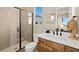 Modern bathroom with a glass-enclosed shower, white quartz counters, and sleek, minimalist design at 227 Paraggi Bay Dr, Henderson, NV 89011