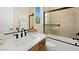 Bright bathroom features a tub, a shower with glass enclosure, and a white quartz countertop at 227 Paraggi Bay Dr, Henderson, NV 89011