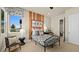 Bright bedroom with bold stripes, a cozy window seat, and stylish decor at 227 Paraggi Bay Dr, Henderson, NV 89011
