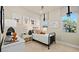 Charming bedroom with natural light, featuring a stylish bed and framed animal art at 227 Paraggi Bay Dr, Henderson, NV 89011