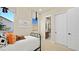 Cozy bedroom with natural light, stylish bedding, and a glimpse into the attached bath at 227 Paraggi Bay Dr, Henderson, NV 89011