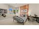 Inviting bedroom featuring a window with picturesque views, a striking headboard, and decorative touches at 227 Paraggi Bay Dr, Henderson, NV 89011