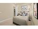 Bedroom featuring golf art, a comfortable bed, and an open closet at 227 Paraggi Bay Dr, Henderson, NV 89011