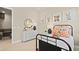 Charming bedroom featuring a white dresser, a bed with neutral bedding, and cute animal-themed art at 227 Paraggi Bay Dr, Henderson, NV 89011