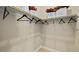 A closet with hanging clothes and bags with shopping theme at 227 Paraggi Bay Dr, Henderson, NV 89011