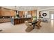 Modern kitchen with stainless steel appliances, large center island, seating, and dining area at 227 Paraggi Bay Dr, Henderson, NV 89011