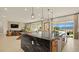 Gourmet kitchen featuring a large island with a black granite countertop at 227 Paraggi Bay Dr, Henderson, NV 89011