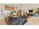 Spacious open-concept kitchen featuring an island, stainless steel appliances, and plenty of natural light at 227 Paraggi Bay Dr, Henderson, NV 89011