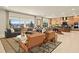 Bright, open-concept living room with a large window view and seamless flow into the modern kitchen area at 227 Paraggi Bay Dr, Henderson, NV 89011