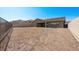 Spacious backyard featuring block wall, covered patio, and low-maintenance landscaping at 241 Paraggi Bay Dr, Henderson, NV 89011