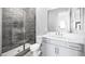 Bathroom with tiled shower, modern vanity and fixtures at 241 Paraggi Bay Dr, Henderson, NV 89011