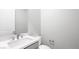 A bathroom with neutral paint, a modern sink, and a matching toilet at 241 Paraggi Bay Dr, Henderson, NV 89011