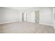 Open bedroom featuring light hard wood flooring and access to a large walk-in closet at 241 Paraggi Bay Dr, Henderson, NV 89011