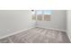 Bright bedroom with three windows and neutral carpeting at 241 Paraggi Bay Dr, Henderson, NV 89011