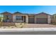 Charming single-story home featuring a three-car garage and stone accents at 241 Paraggi Bay Dr, Henderson, NV 89011