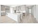 Modern kitchen featuring white cabinets, marble countertops, stainless steel appliances and center island at 241 Paraggi Bay Dr, Henderson, NV 89011