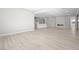 Open floor plan with modern kitchen, fireplace, and light, sleek flooring at 241 Paraggi Bay Dr, Henderson, NV 89011