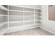Bright pantry featuring rows of white shelving for ample storage space at 241 Paraggi Bay Dr, Henderson, NV 89011