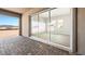 Covered patio with stone pavers and a sliding glass door to the home's interior at 241 Paraggi Bay Dr, Henderson, NV 89011