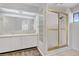 Bathroom featuring double sinks, shower with glass doors, and plenty of natural light at 2935 Hardin Dr, Henderson, NV 89074