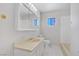 Well-lit bathroom with vanity mirror, a tiled shower, and a small window at 2935 Hardin Dr, Henderson, NV 89074