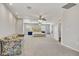 Bright and spacious bedroom with sitting area, ceiling fan, and large bed with side tables at 2935 Hardin Dr, Henderson, NV 89074
