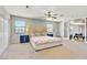 Large primary bedroom suite with carpet, ceiling fan, views to the outside, and bright, natural light at 2935 Hardin Dr, Henderson, NV 89074