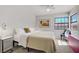 Cozy bedroom featuring a large window, natural light, and stylish decor at 2935 Hardin Dr, Henderson, NV 89074