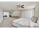 Expansive bedroom with an ensuite sitting area, ceiling fans, and a large closet with folding doors at 2935 Hardin Dr, Henderson, NV 89074