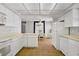 Bright kitchen with adjacent dining area, essential appliances, and white cabinetry at 2935 Hardin Dr, Henderson, NV 89074