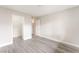Bright bedroom features wood-look flooring, base molding, and white walls at 3151 Soaring Gulls Dr # 2180, Las Vegas, NV 89128