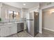 Updated kitchen featuring stainless steel refrigerator and dishwasher at 3151 Soaring Gulls Dr # 2180, Las Vegas, NV 89128