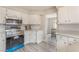 Clean and modern kitchen with stainless steel appliances, white cabinets, and a view to the dining area at 3151 Soaring Gulls Dr # 2180, Las Vegas, NV 89128