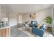 Cozy living room featuring stylish sofas, a round coffee table, attractive artwork, and a vibrant potted plant at 3151 Soaring Gulls Dr # 2180, Las Vegas, NV 89128