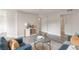 Well-lit living area with modern furniture, a decorative table, and a glimpse into an adjacent room, offering a comfortable space at 3151 Soaring Gulls Dr # 2180, Las Vegas, NV 89128