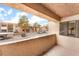Private patio with view of community buildings, trees, and parking at 3151 Soaring Gulls Dr # 2180, Las Vegas, NV 89128