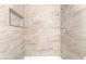 Walk-in shower features decorative tile surround and shower niche at 3151 Soaring Gulls Dr # 2180, Las Vegas, NV 89128
